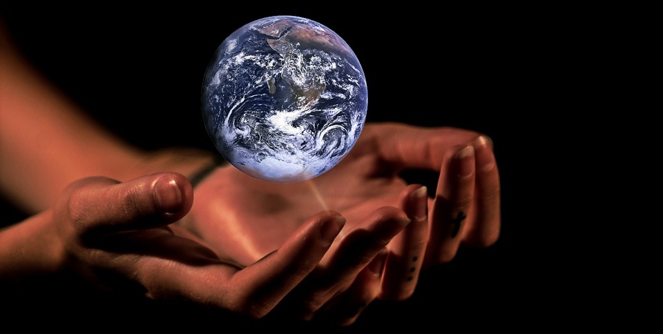 Hands caring for the planet